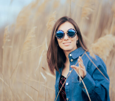 Pretty fashionista following style trends posing outdoors