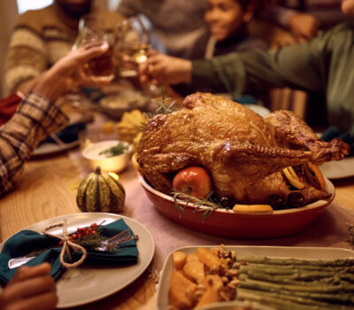 Close up of Thanksgiving turkey during family dinner at dining table.